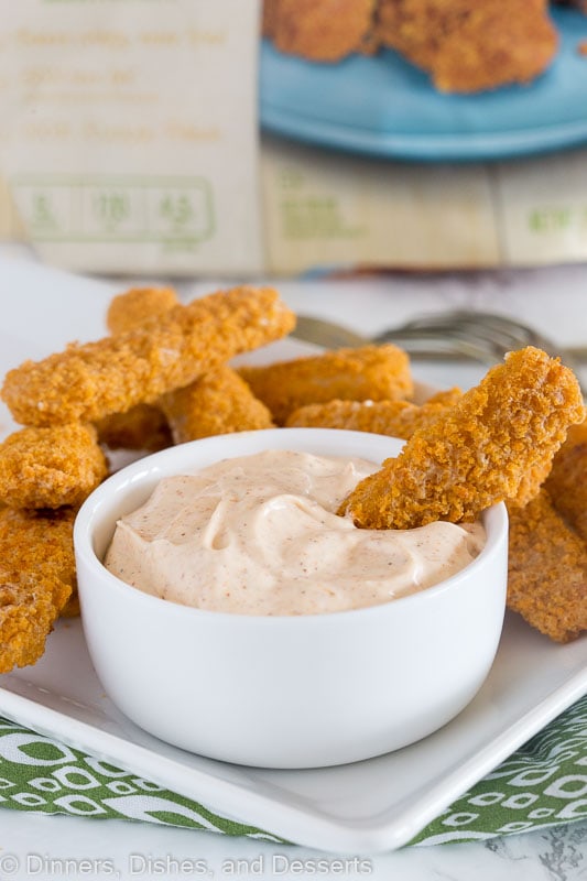 dipping sauce in a bowl with fish sticks