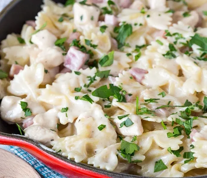 pasta with diced ham in a skillet