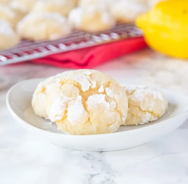 Lemon Crinkle Cookies -Made from scratch lemon cookies that are sweet and slightly tart.  Super soft on the inside with slightly crispy edges.