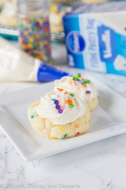 funfettie cookies with frosting and sprinkles on a plate