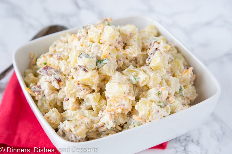 A bowl of food with Potato and Salad