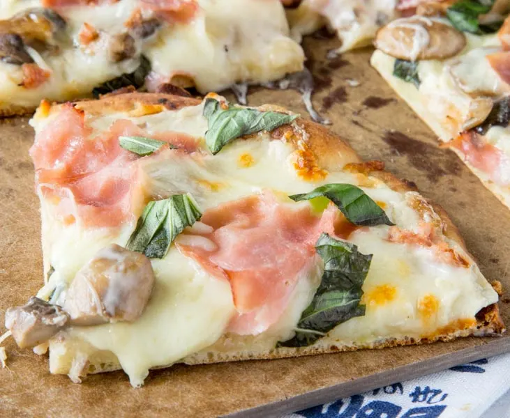 Mushroom and Ham White Pizza - roasted garlic white sauce with sauteed mushrooms, cheese, and ham make for a delicious pizza. Great way to use what you already have on hand!  