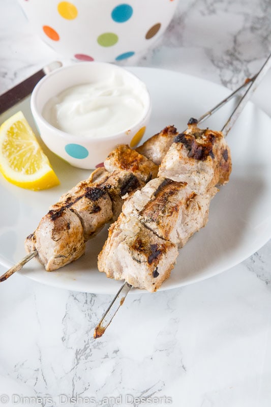 A plate of food with a fork, with Yogurt and Pork