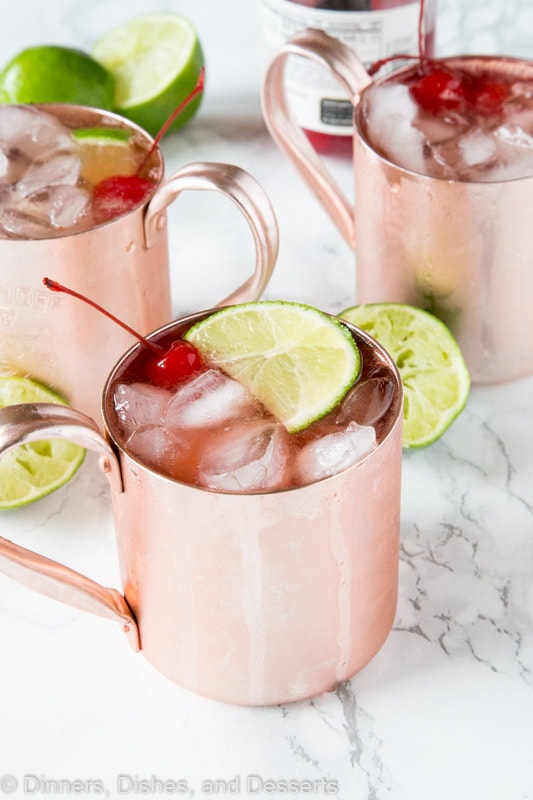 Cherry Lime and Moscow mule in a glass with lime slices