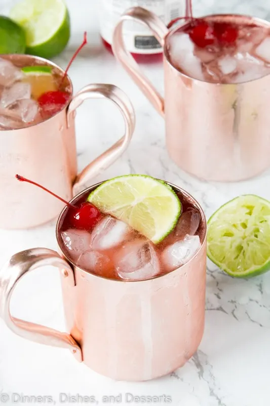 Cherry Lime and Moscow mule in a glass with lime slices