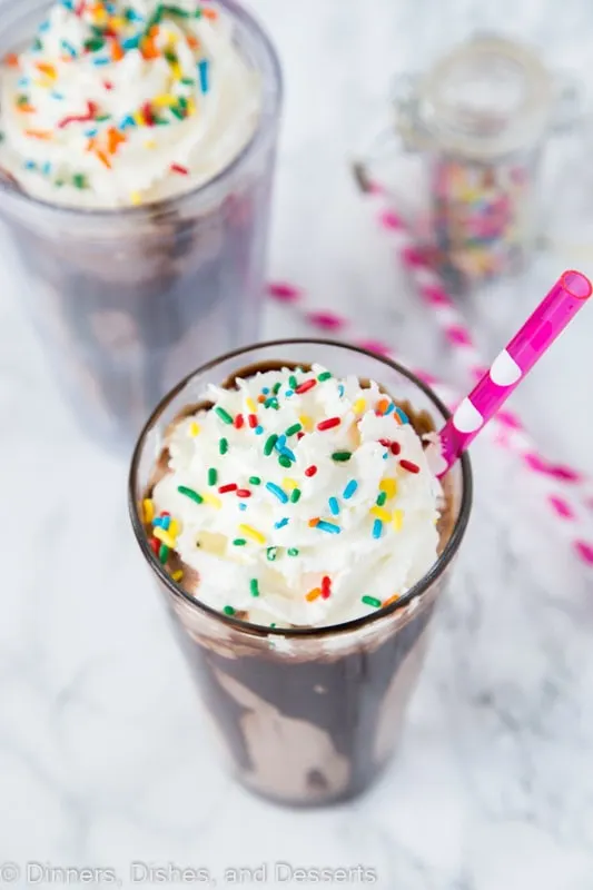 Chocolate Milkshake Recipe - the best way to cool off this summer with a homemade chocolate milkshake topped with whipped cream and sprinkles!