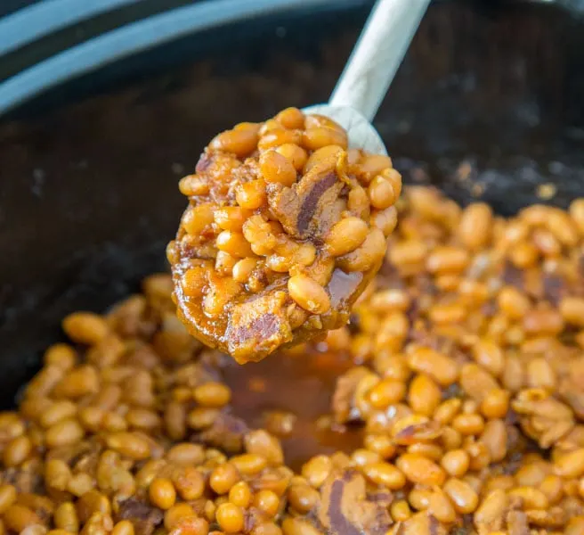 A crock pot with baked beans
