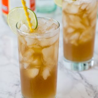 long island iced tea in a glass with a straw