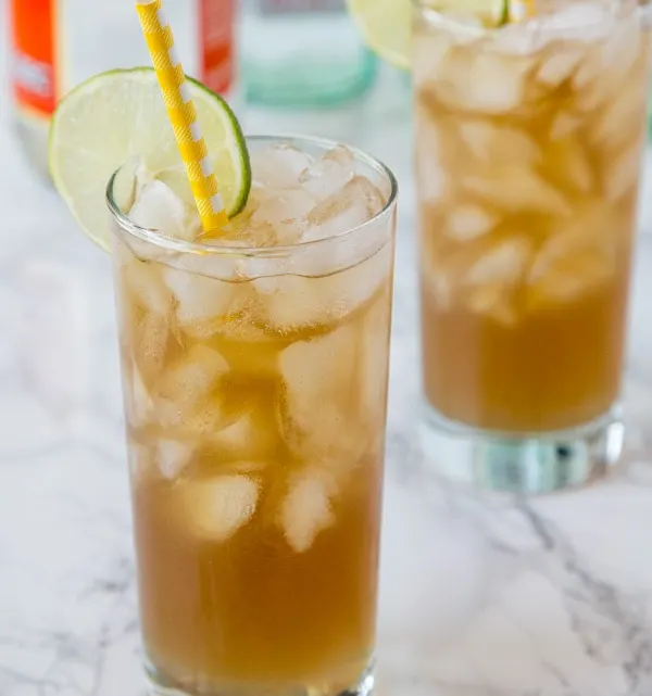 long island iced tea in a glass with a straw