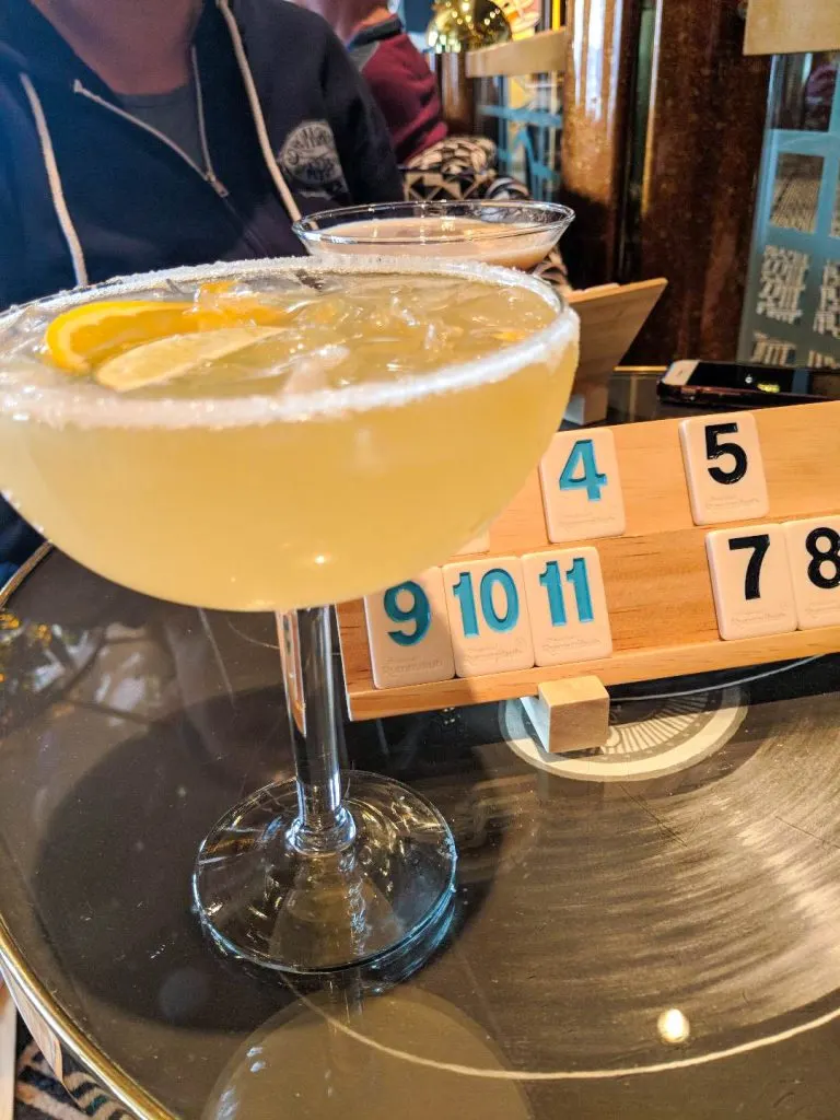 margarita at a table with a board game