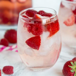 Berry Rosé Sangria - Use Rose wine to make this refreshing and easy sangria for summer. Loaded with raspberry and strawberries for a great summer cocktail.
