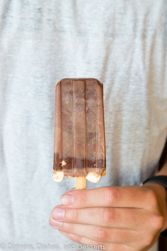 person holding hot chocolate popsicle