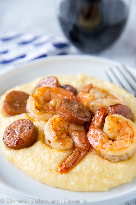 A plate of food, with Grits and shrimp