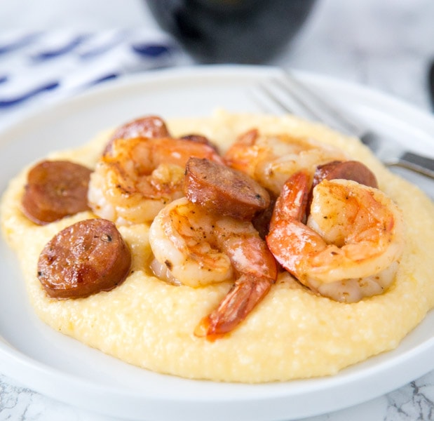 Shrimp and Grits Recipe - this easy shrimp and grits is ready in minutes and is perfect for busy weeknights.  Cheesy grits take it over the top, the whole family is going to love it!  