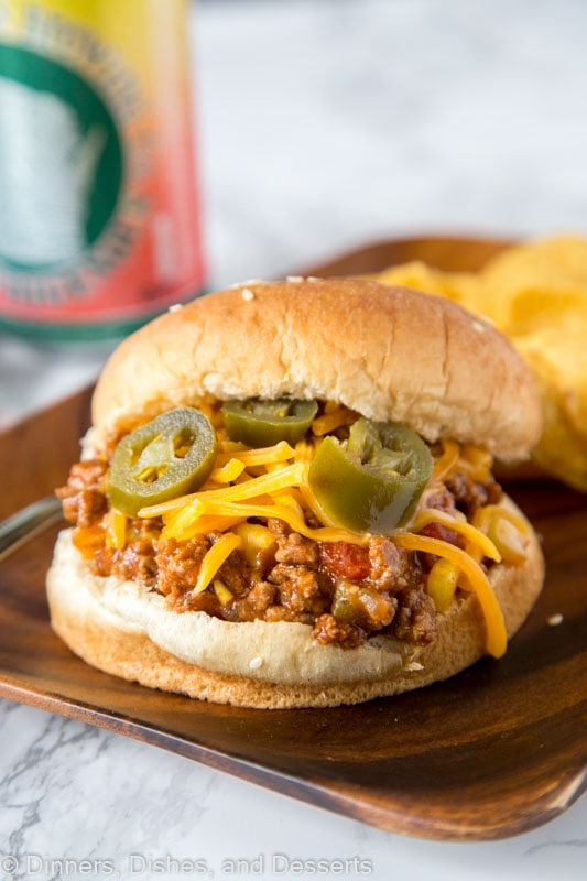 Taco Sloppy Joes - homemade sloppy Joes just got a Mexican makeover! Seasoned with taco seasoning, chilies and topped with cheese make them perfect for any night of the week!