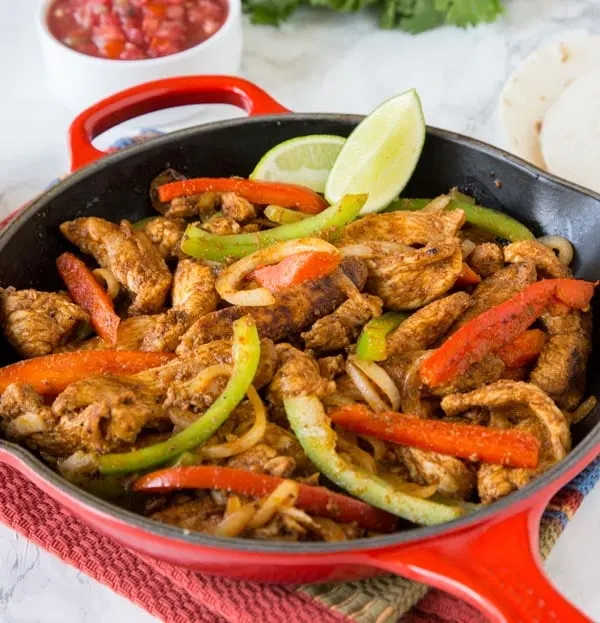 Easy Chicken Fajitas - skip going out and make chicken fajitas at home!  Super easy to make any night of the week, take your taco night to a whole new level!