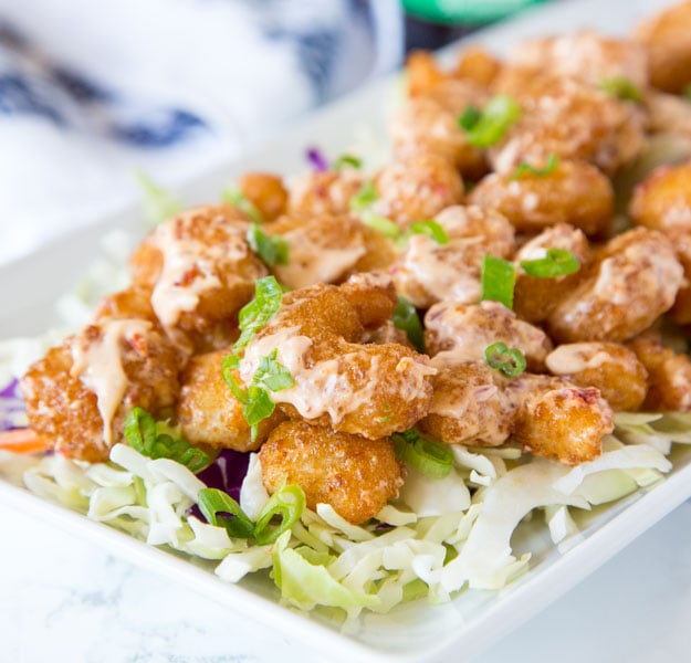 Bang Bang Shrimp Recipe - Crispy fried shrimp that is tossed in a sweet, spicy, and tangy sauce. The ultimate appetizer that will soon become your dinner! 