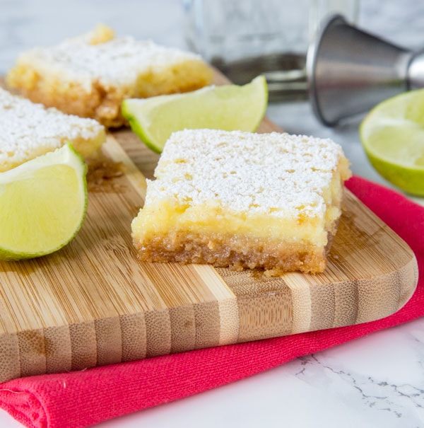 Margarita Bars Recipe - If you like classic lemon bars, you are going to love this lime bars spiked with tequila!  Everyone's favorite cocktail turned in to a creamy and delicious dessert!