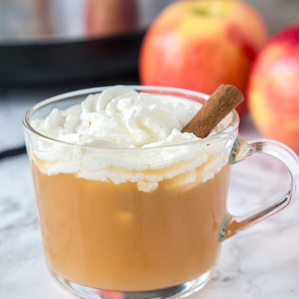 Warm Vanilla Cider - Warm up this fall with a glass of hot apple cider. Fresh vanilla bean is mixed in for a warm and delicious flavor. Topped off with homemade whipped cream for a special treat!