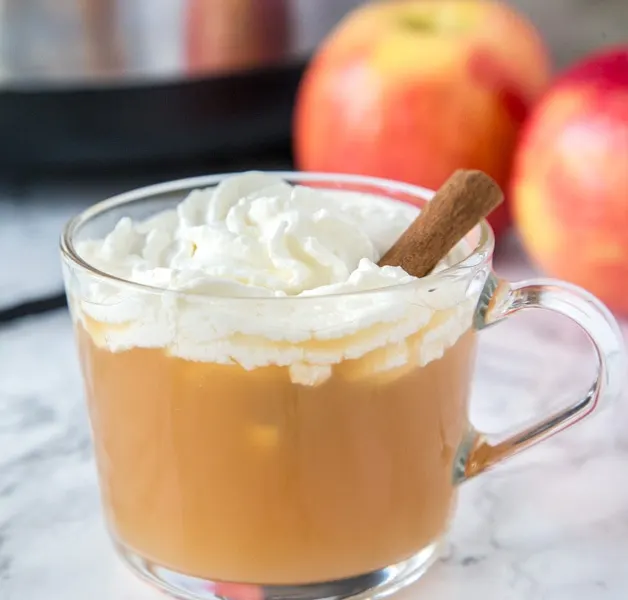 Warm Vanilla Cider - Warm up this fall with a glass of hot apple cider. Fresh vanilla bean is mixed in for a warm and delicious flavor. Topped off with homemade whipped cream for a special treat!