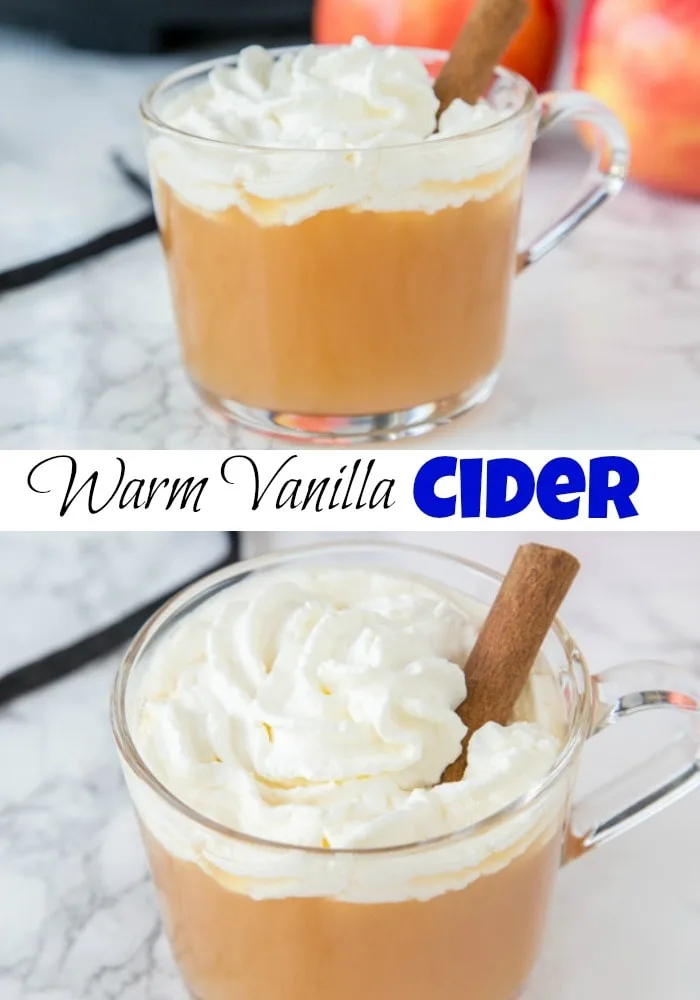 warm cider in a cup topped with whipped cream