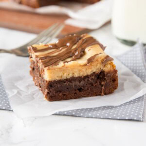 Peanut Butter Cheesecake Brownies - rich and fudgy brownies with a layer of creamy peanut butter cheesecake and topped with even more chocolate! A dessert lovers dream!