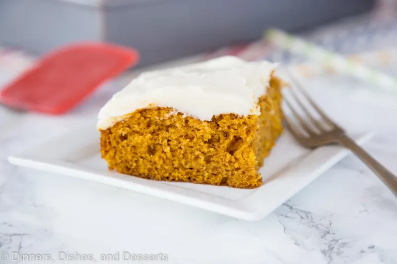 A piece of cake on a plate, with Pumpkin and Cream