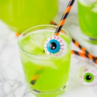 Hawaiian Punch Cocktail - Halloween cocktails are so much fun!  This starts with green Hawaiian punch, and has a version for adults and the kids!