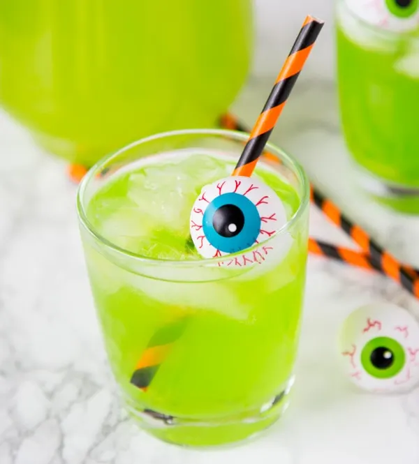 Hawaiian Punch Cocktail - Halloween cocktails are so much fun!  This starts with green Hawaiian punch, and has a version for adults and the kids!