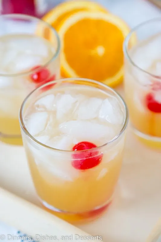 whiskey sour drink on a tray