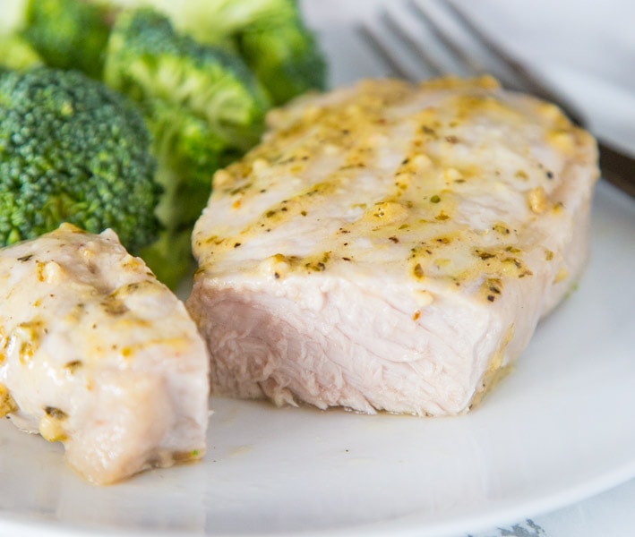 A close up of a plate of food with broccoli, with Pork