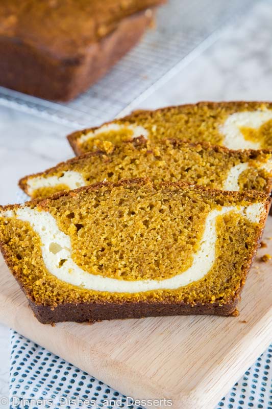 A slice of pumpkin bread with cream cheese swirl