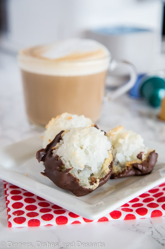 coconut macaroons on a plate with a cup of coffee