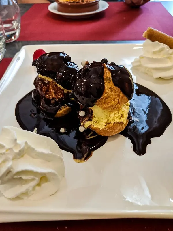 Where to Eat in Paris - Planning a trip to Paris and wondering where to eat?  Here are some of our favorites from out trip!  Au Gateau Brenton profiteroles