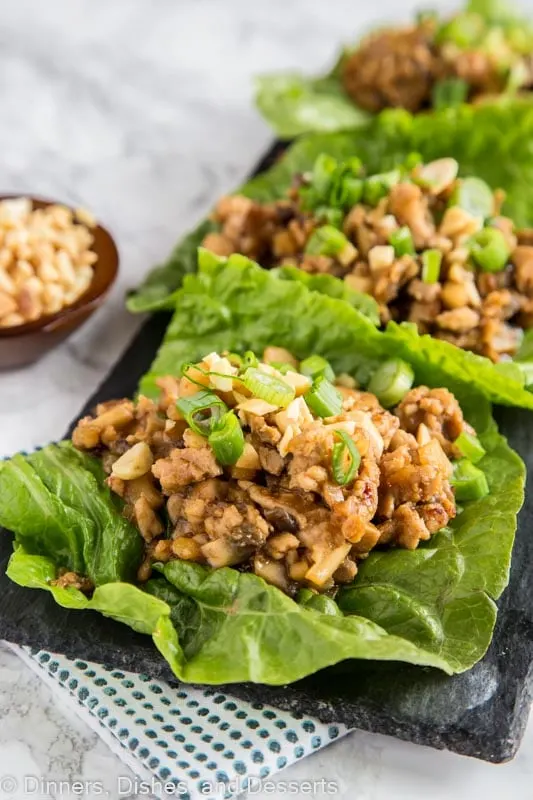 A dish is filled with food, with Lettuce and Wrap