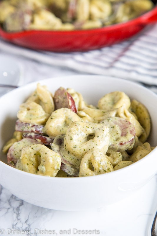 A bowl of food on a plate, with Pesto and Cream