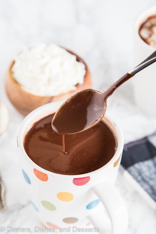 A cup of hot chocolate with a spoon, with Chocolate and Hot chocolate