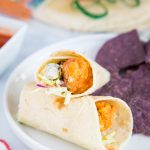 A piece of food on a plate, with Chicken and Wrap