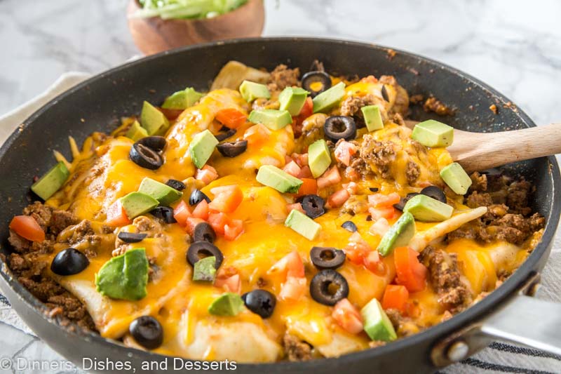 A pan filled with food, with Taco and Pierogi