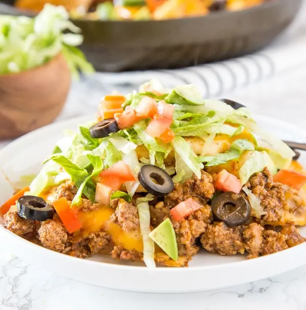 Pierogies Taco Skillet - Cheese filled pierogies get a Mexican twist with taco meat, salsa, and plenty of cheese!  Great weeknight meal that is ready in no time.  