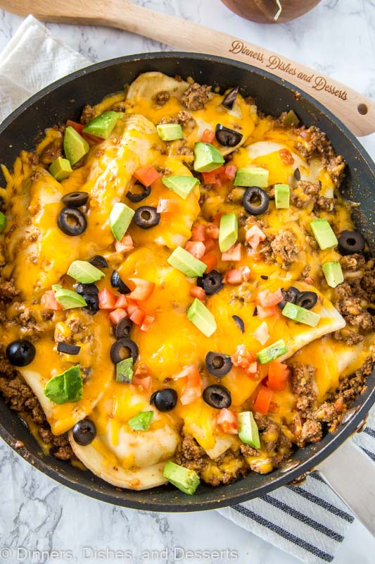 A pan of food on a plate, with Taco and Pierogi