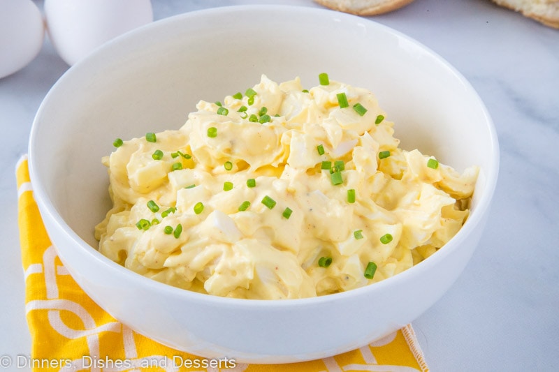 A bowl of egg salad with chives