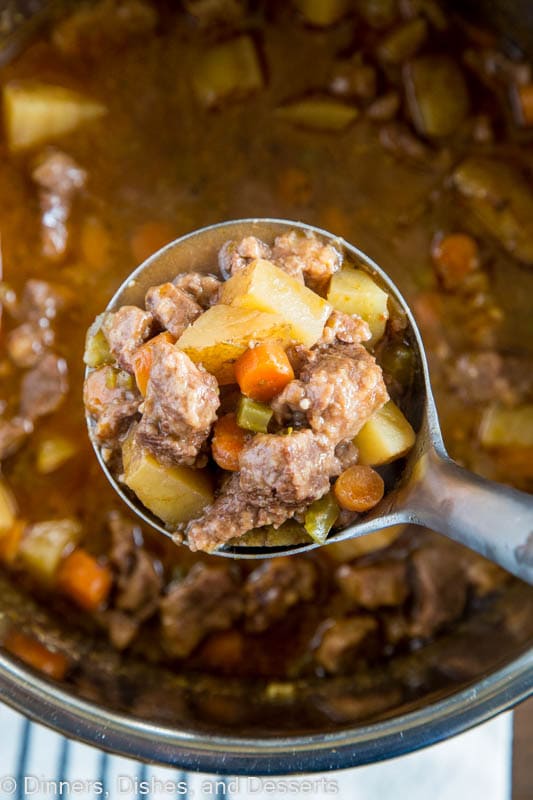 A bowl of food with stew, with Beef and Dinner