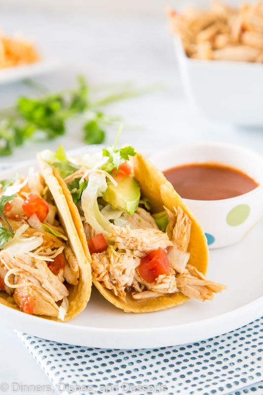 A plate of food on a table, with Taco and Chicken