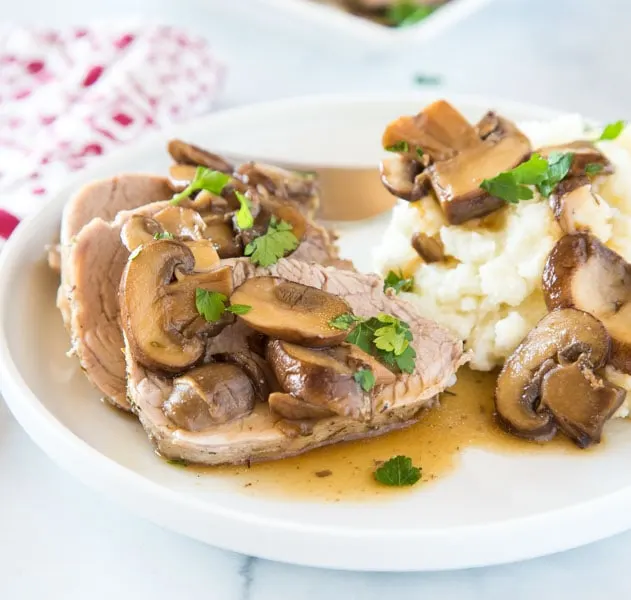 Instant Pot Pork Tenderloin - a tender and juicy pork tenderloin that is cooked in the instant pot with an easy mushroom sauce! 