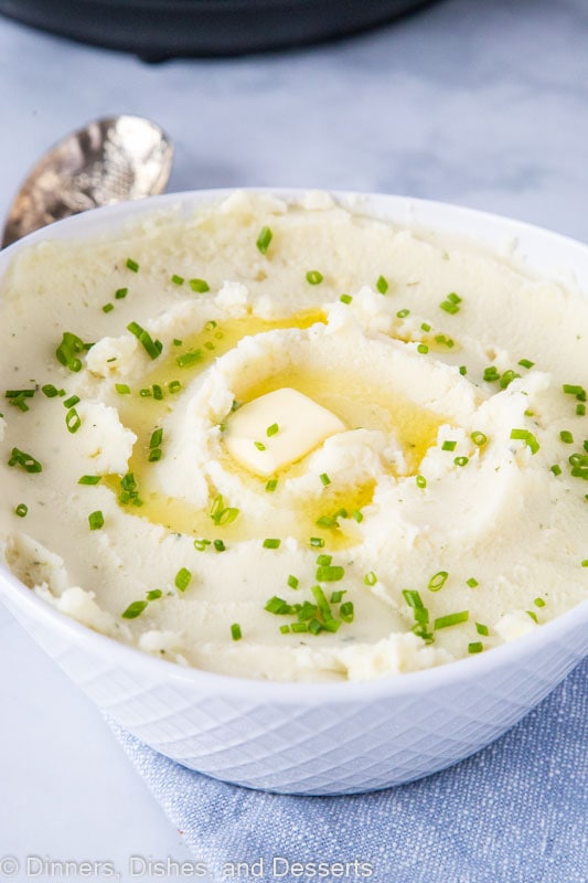 A bowl of potatoes with butter