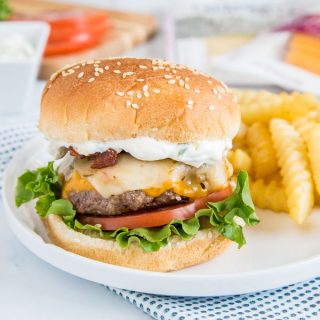 Spicy Bacon Cheeseburger - get ready for summer with easy homemade hamburgers topped with bacon, cheese, and a spicy ranch sauce!  