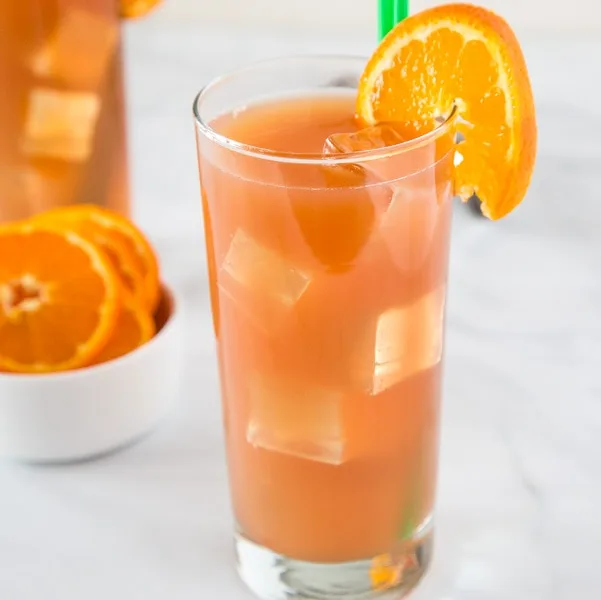 A close up of a glass of orange juice