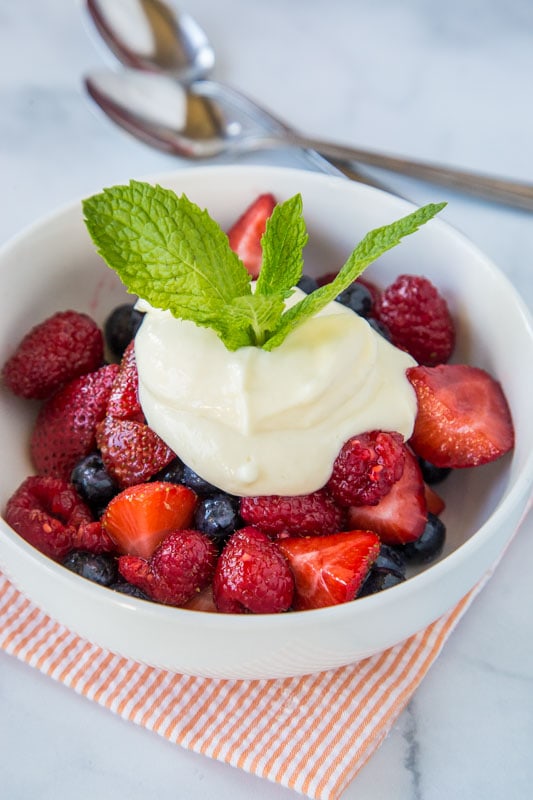 Berry fruit salad topped with lemon yogurt sauce