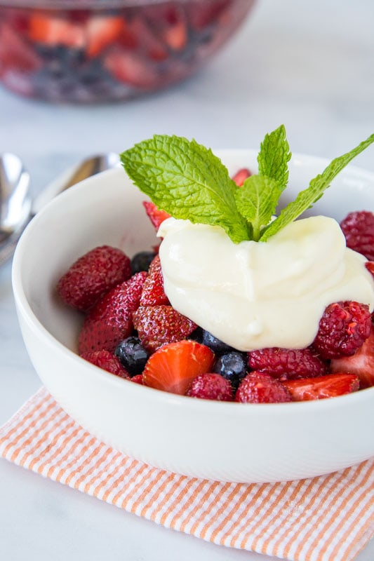 Super easy fruit salad with fresh berries and topped with a homemade lemon yogurt